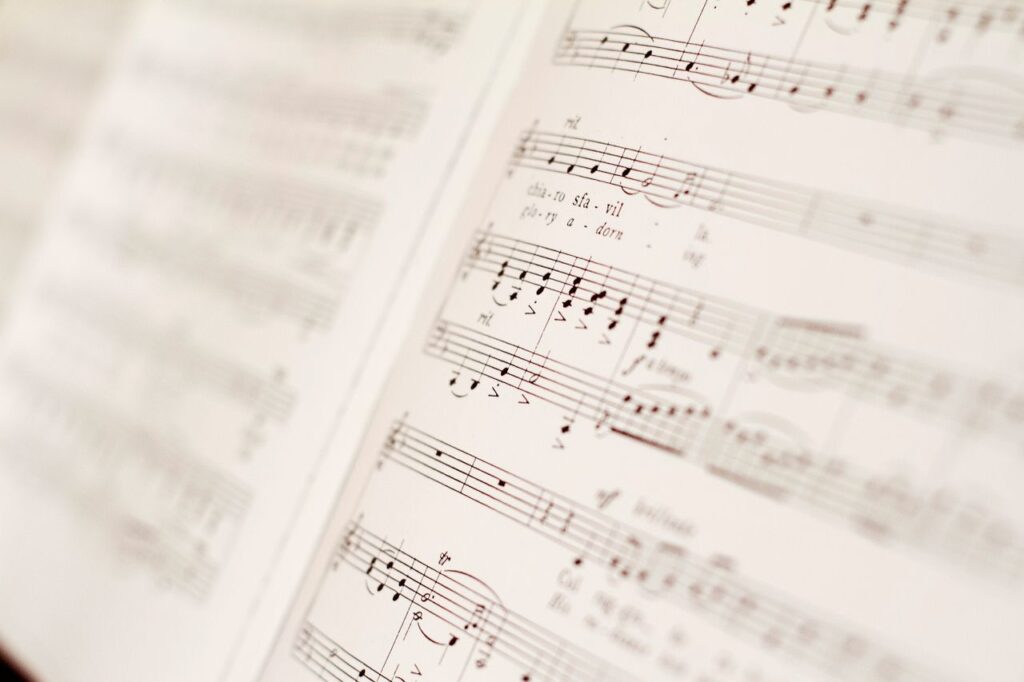 Detailed close-up of classical music notes on sheet paper, showing composition and notation.